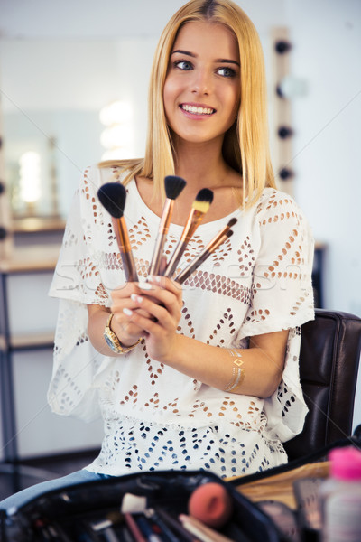 Woman holding brushes  Stock photo © deandrobot