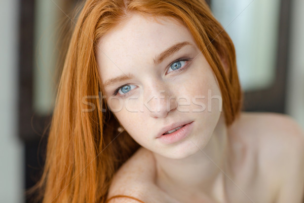 Thoughtful redhair woman looking away Stock photo © deandrobot
