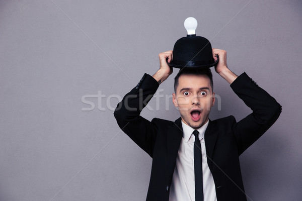 Concept photo of a businessman having idea Stock photo © deandrobot