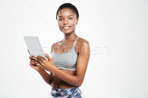 Lächelnd afro Frau Tablet-Computer schauen Stock foto © deandrobot