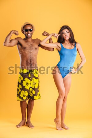 Couple standing with water guns isolated Stock photo © deandrobot