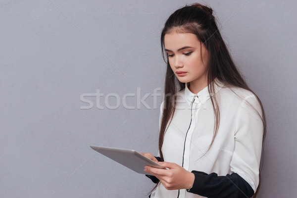 Asian model with tablet computer Stock photo © deandrobot
