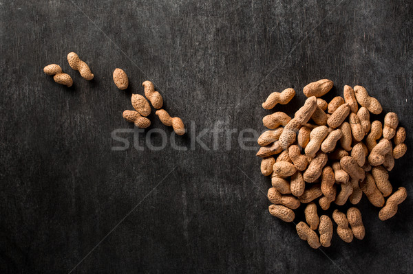 Dried peanut on dark background Stock photo © deandrobot