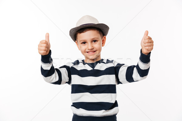 Portrait of a kid in a hat showing thumbs up Stock photo © deandrobot