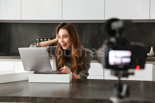 Happy young girl recording video blog episode Stock photo © deandrobot