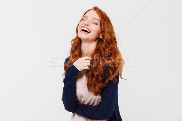 Laughing young redhead lady. Eyes closed. Stock photo © deandrobot