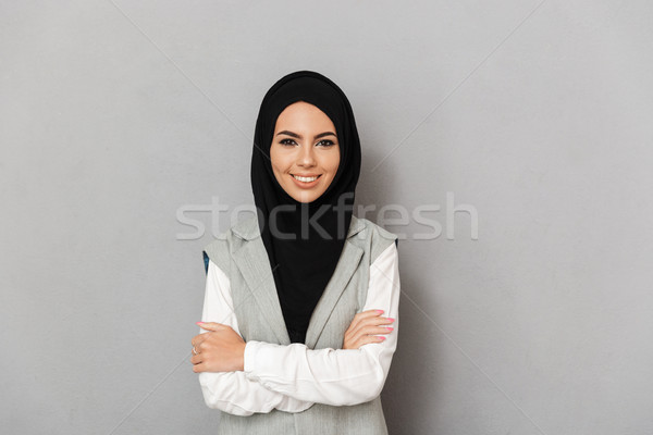 Portrait of a happy young arabian woman Stock photo © deandrobot