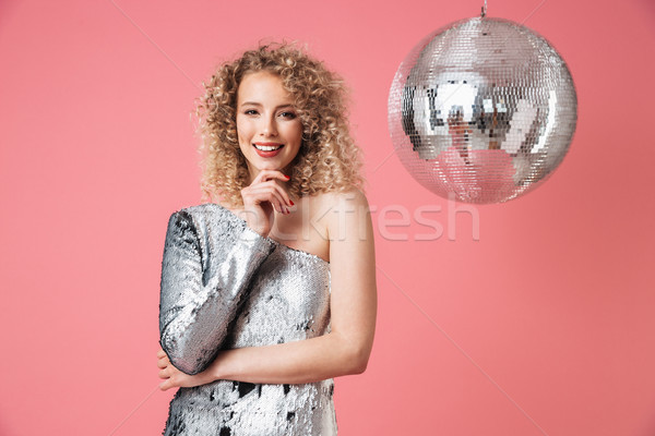 Portrait of a smiling beautiful woman in shiny dress Stock photo © deandrobot