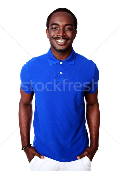 Glimlachend afrikaanse man Blauw tshirt permanente Stockfoto © deandrobot