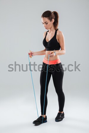 Fitnessz nő sportok ruházat cipőfűző izolált fehér Stock fotó © deandrobot