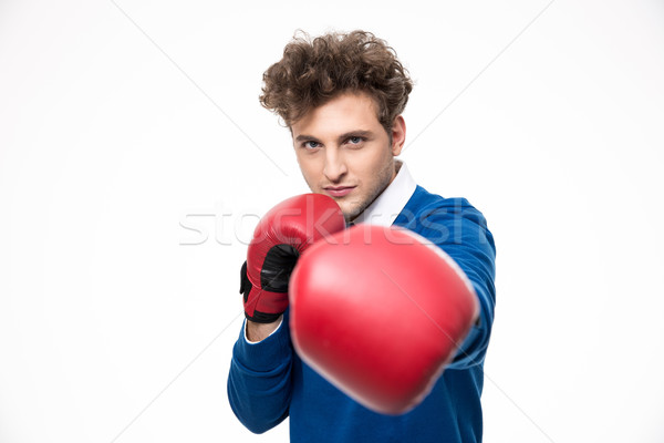 Business man in boxing gloves punching at the camera Stock photo © deandrobot