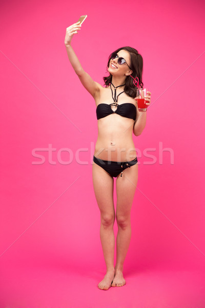 Happy woman making selfie photo  Stock photo © deandrobot