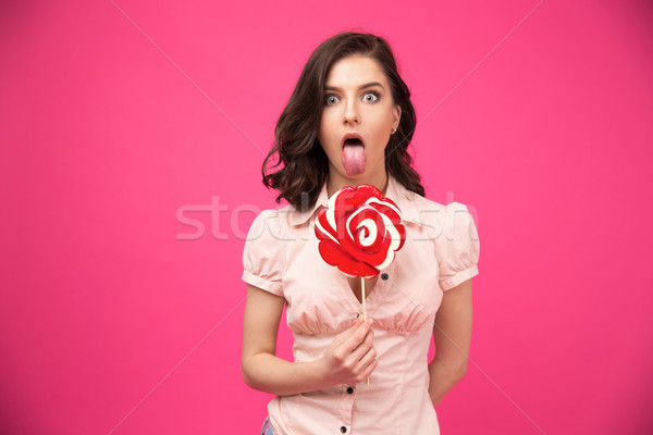 年輕女子 棒糖 舌頭 掛 出 商業照片 © deandrobot