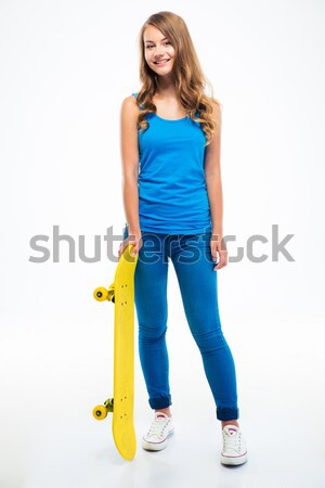 Ocazional femeie în picioare skateboard portret Imagine de stoc © deandrobot