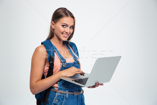 Stockfoto: Gelukkig · cute · vrouwelijke · student · met · behulp · van · laptop · geïsoleerd