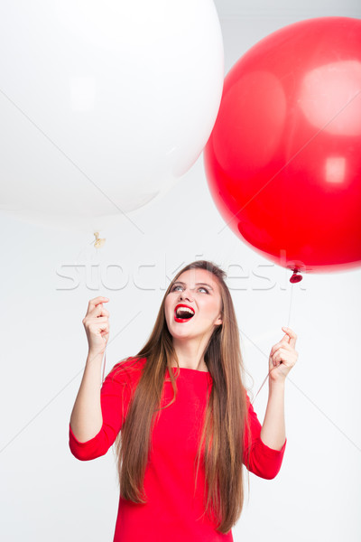 Feliz mujer abierto boca globos Foto stock © deandrobot