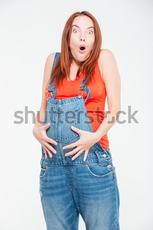 Meglepett terhes nő áll izolált fehér háttér Stock fotó © deandrobot