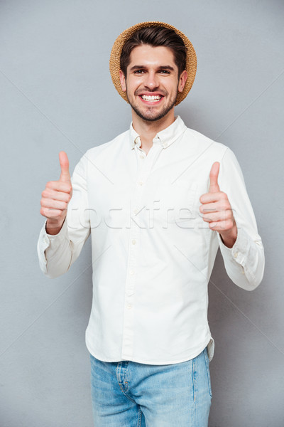 Mosolyog férfi kalap mutat remek mindkettő Stock fotó © deandrobot