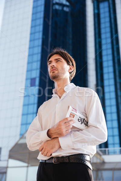 Strict businessman in city Stock photo © deandrobot