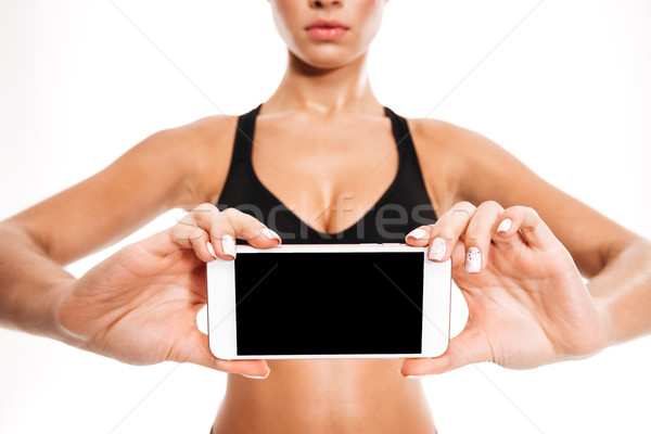 Stock fotó: Fitnessz · nő · tart · képernyő · mobiltelefon · kettő · kezek