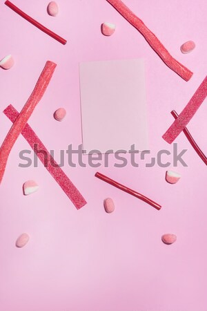 Top view of red sugar candies and lollies Stock photo © deandrobot