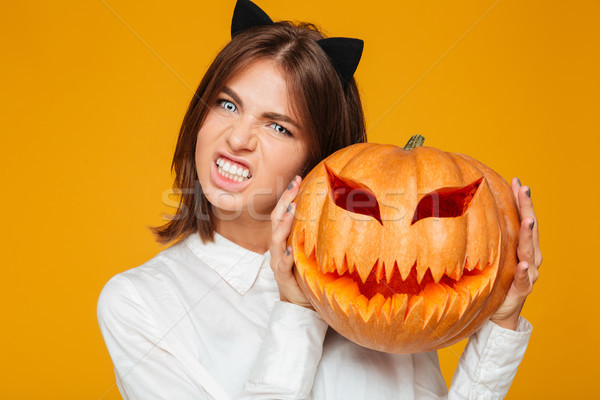 érzelmes fiatal nő őrült macska halloween jelmez Stock fotó © deandrobot
