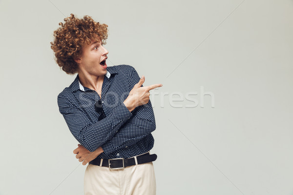 Retro man dressed in shirt standing and posing Stock photo © deandrobot