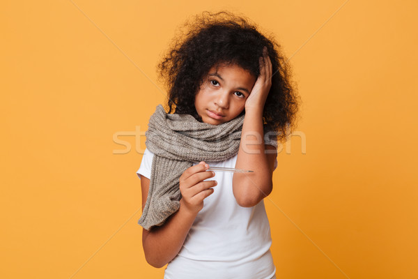 Close up portrait of a sick afro american girl Stock photo © deandrobot