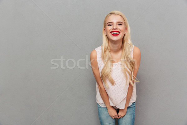 Portrait of a laughing girl Stock photo © deandrobot