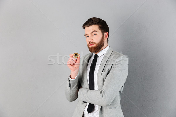 Portrait of a confident businessman dressed in suit Stock photo © deandrobot