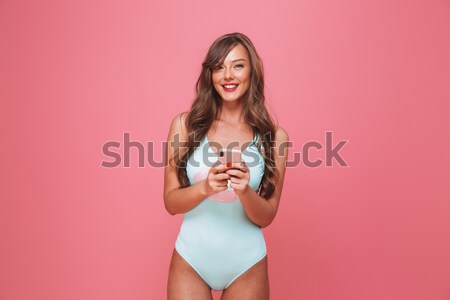 肖像 年輕女子 泳裝 手機 商業照片 © deandrobot