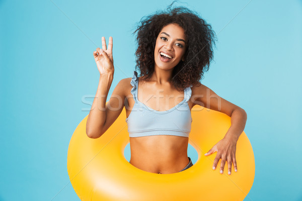 Portrait of an excited african girl Stock photo © deandrobot