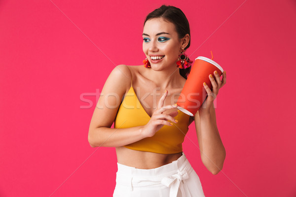 Photo of beautiful fashion woman 20s wearing earrings smiling an Stock photo © deandrobot