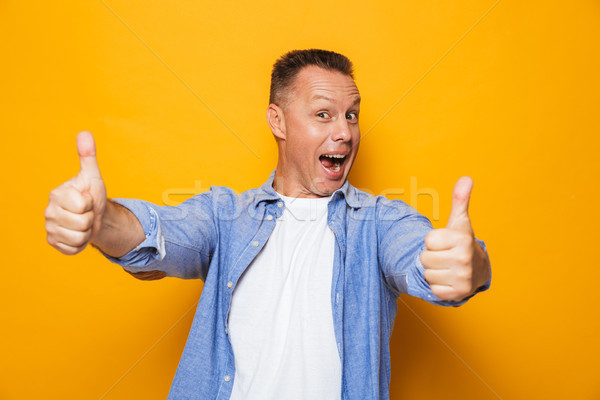 Stock photo: Portrait of a joyful middle aged man