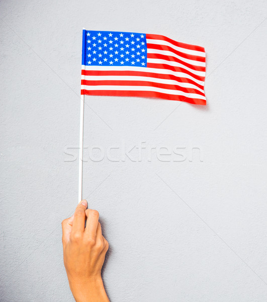 Mano bandiera americana primo piano ritratto grigio Foto d'archivio © deandrobot