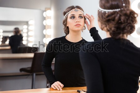 Woman applying lipstick on her lips Stock photo © deandrobot