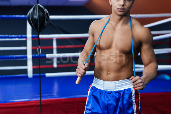 Boxer standing with skipping rope Stock photo © deandrobot