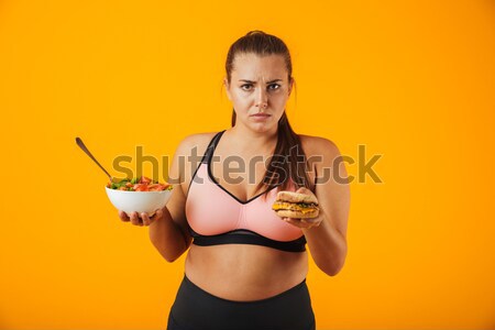 Young sexy girl holding water gun and posing in bikini Stock photo © deandrobot