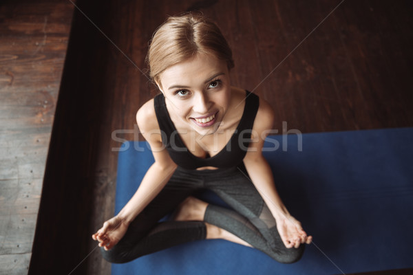 Kadın oturma spor salonu yoga görüntü Stok fotoğraf © deandrobot