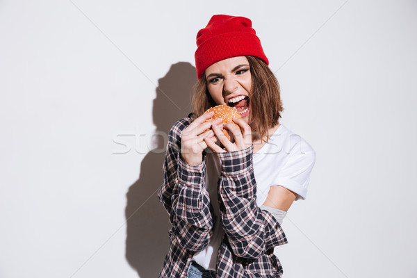 飢えた 女性 ハンバーガー 写真 シャツ ストックフォト © deandrobot