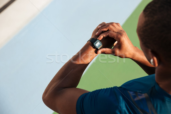 Top view close up of a fit african sportsman Stock photo © deandrobot
