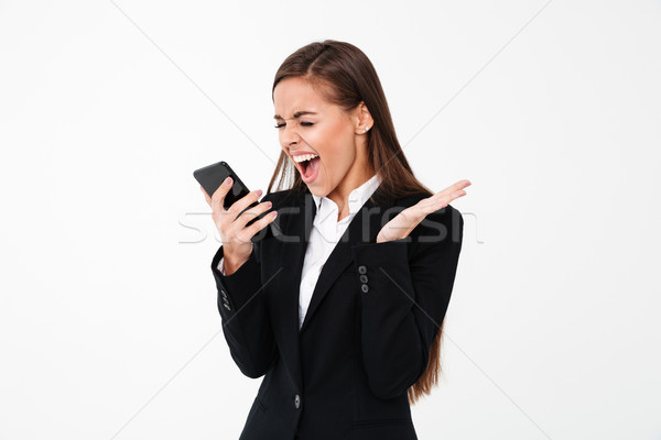 Enojado gritando mujer de negocios teléfono imagen pie Foto stock © deandrobot