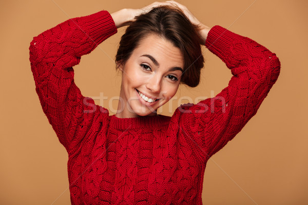 Close-up portrait of charming brunette woman making hairstyle, l Stock photo © deandrobot