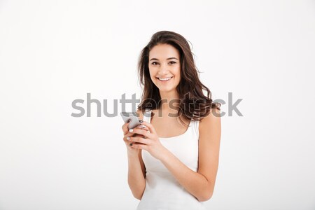 Portrait of a pretty girl dressed in tank-top Stock photo © deandrobot