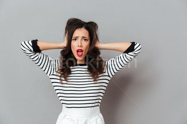 Retrato confuso menina em pé brasão cabeça Foto stock © deandrobot
