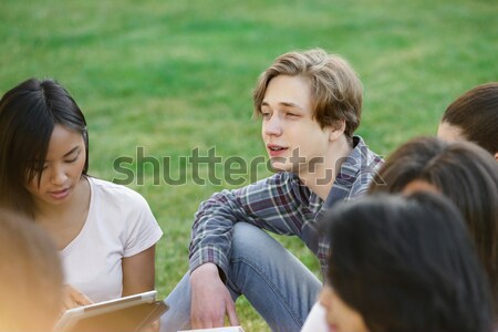 Stock photo: Happy couple talking to their grandparents while talking