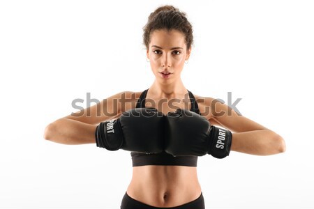 Komoly fürtös barna hajú fitnessz nő boxkesztyűk tart Stock fotó © deandrobot