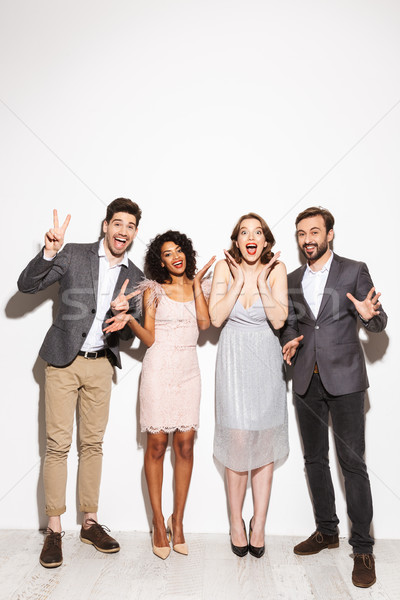 Group of happy well dressed multiracial people Stock photo © deandrobot