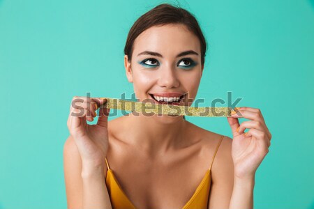 Close up portrait of a cheerful young girl Stock photo © deandrobot