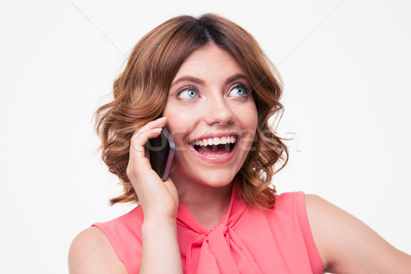 Laughing woman talking on the phone Stock photo © deandrobot